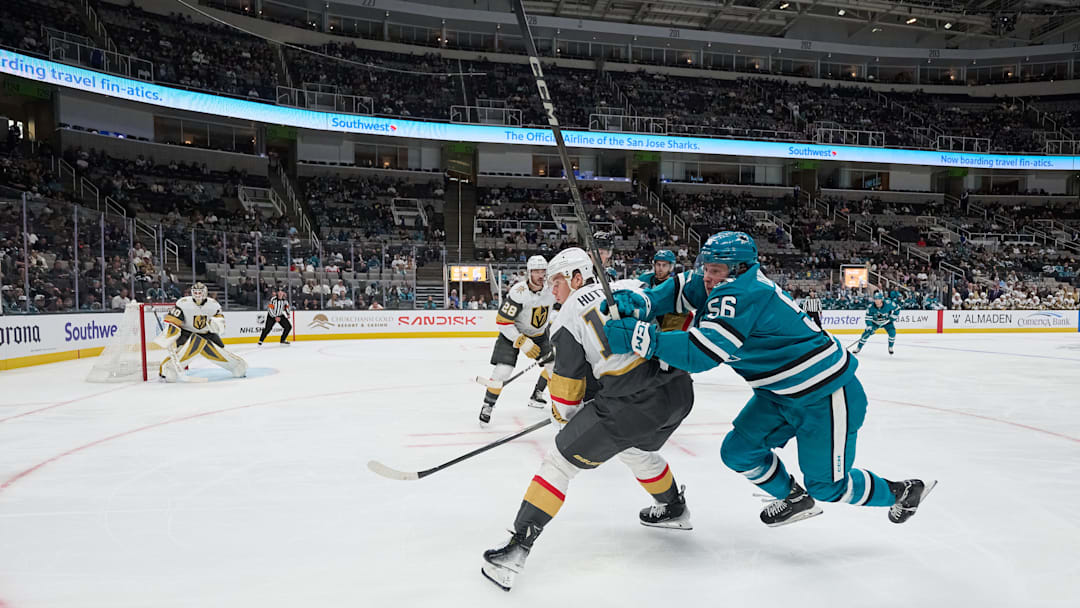 Sep 26, 2025; San Jose, California, USA; San Jose Sharks right wing Ethan Cardwell (56) vies for position against Vegas Golden Knights defenseman Ben Hutton (17) with center Tanner Laczynski (28) and goaltender Akira Schmid (40) during the second period at SAP Center at San Jose. Mandatory Credit: Robert Edwards-Imagn Images