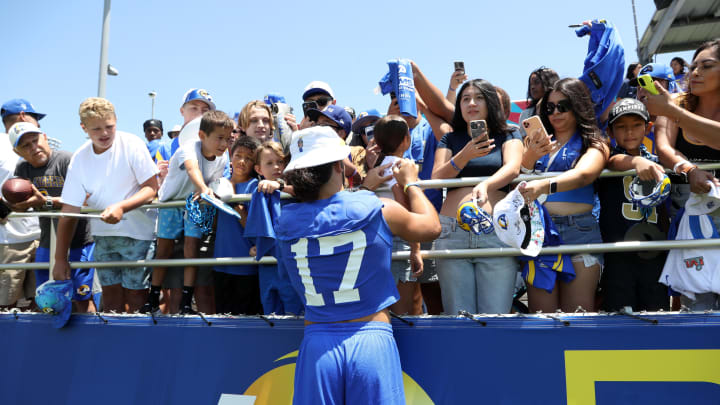 Jul 31, 2024; Los Angeles, CA, USA;  Los Angeles Rams wide receiver Puka Nacua (17) signs autographs after training camp at Loyola Marymount University. Mandatory Credit: Kiyoshi Mio-USA TODAY Sports