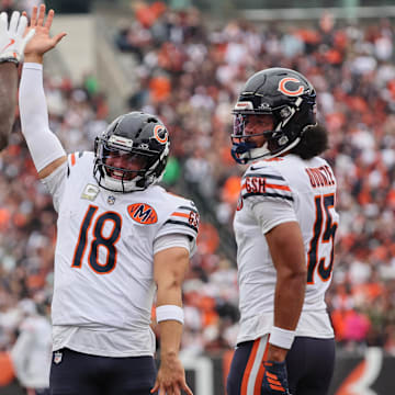 Caleb Williams celebrates his touchdown catch against the Bengals in Sunday's 47-42 victory.