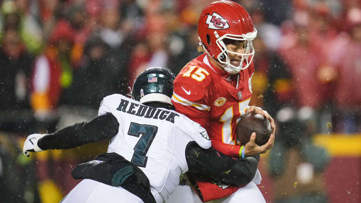 Nov 20, 2023; Kansas City, Missouri, USA; Kansas City Chiefs quarterback Patrick Mahomes (15) is sacked by Philadelphia Eagles linebacker Haason Reddick (7) during the first half at GEHA Field at Arrowhead Stadium. Mandatory Credit: Jay Biggerstaff-USA TODAY Sports