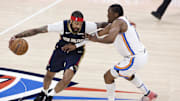 Apr 21, 2024; Oklahoma City, Oklahoma, USA; New Orleans Pelicans forward Brandon Ingram (14) drives around Oklahoma City Thunder forward Jalen Williams (8) during the first quarter of game one of the first round for the 2024 NBA playoffs at Paycom Center. 