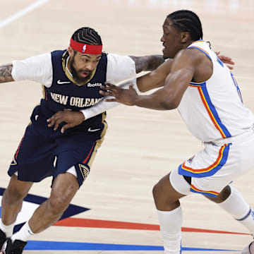 Apr 21, 2024; Oklahoma City, Oklahoma, USA; New Orleans Pelicans forward Brandon Ingram (14) drives around Oklahoma City Thunder forward Jalen Williams (8) during the first quarter of game one of the first round for the 2024 NBA playoffs at Paycom Center. 