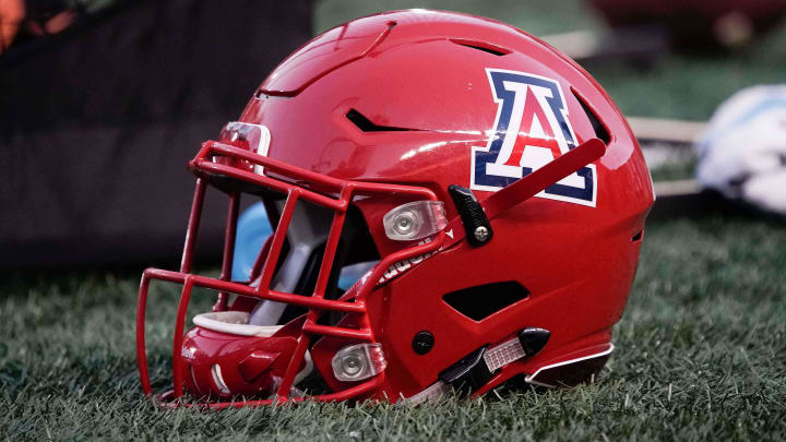 Arizona Wildcats helmet sits on the grass