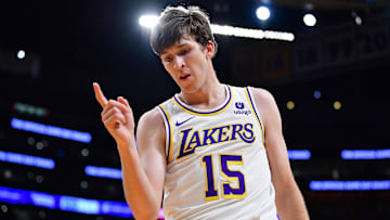 Dec 25, 2023; Los Angeles, California, USA; Los Angeles Lakers guard Austin Reaves (15) reacts after drawing a foul against the Boston Celtics during the first half at Crypto.com Arena. Mandatory Credit: Gary A. Vasquez-Imagn Images