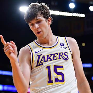 Dec 25, 2023; Los Angeles, California, USA; Los Angeles Lakers guard Austin Reaves (15) reacts after drawing a foul against the Boston Celtics during the first half at Crypto.com Arena. Mandatory Credit: Gary A. Vasquez-Imagn Images