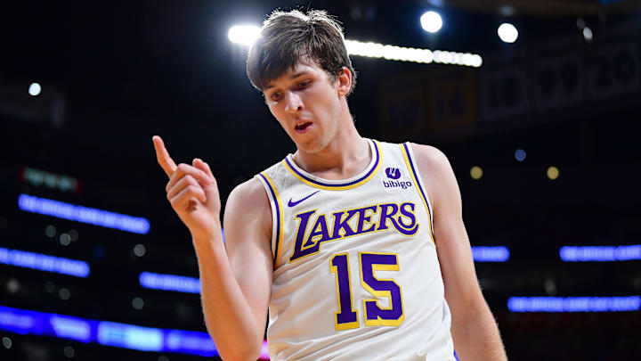 Dec 25, 2023; Los Angeles, California, USA; Los Angeles Lakers guard Austin Reaves (15) reacts after drawing a foul against the Boston Celtics during the first half at Crypto.com Arena. Mandatory Credit: Gary A. Vasquez-Imagn Images