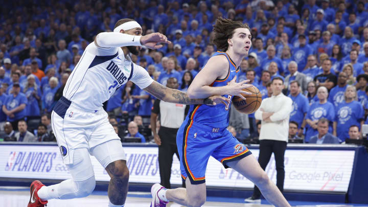 May 9, 2024; Oklahoma City, Oklahoma, USA; Oklahoma City Thunder guard Josh Giddey (3) drives to the basket beside Dallas Mavericks center Daniel Gafford (21) during the first quarter of game two of the second round for the 2024 NBA playoffs at Paycom Center. Mandatory Credit: Alonzo Adams-USA TODAY Sports