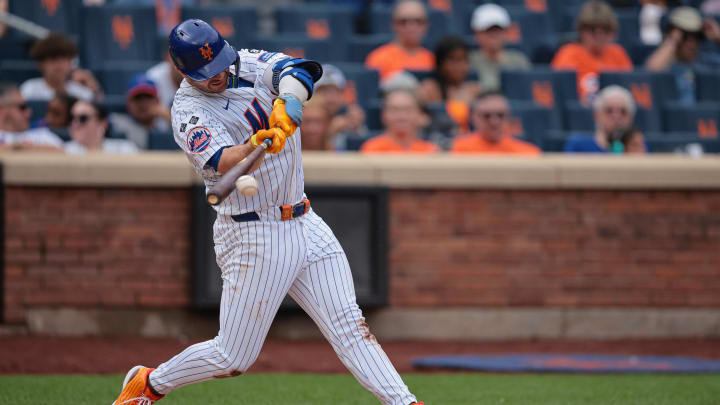 Aug 18, 2024; New York City, New York, USA;  New York Mets first baseman Pete Alonso (20) singles during the fourth inning against the Miami Marlins at Citi Field.