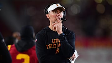 Nov 7, 2025; Los Angeles, California, USA; Southern California Trojans head coach Lincoln Riley watches game action against the Northwestern Wildcats during the second half at the Los Angeles Memorial Coliseum. Mandatory Credit: Gary A. Vasquez-Imagn Images