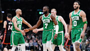 Apr 24, 2024; Boston, Massachusetts, USA; Boston Celtics guard Jaylen Brown (7), forward Jayson Tatum (0), guard Derrick White (9) and forward Sam Hauser (30) walk to the bench during a timeout against the Miami Heat in the second quarter during game two of the first round for the 2024 NBA playoffs at TD Garden. Mandatory Credit: David Butler II-Imagn Images