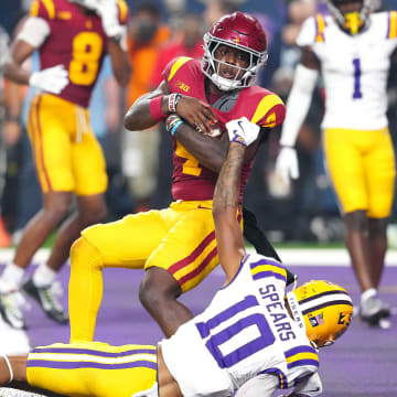 Sep 1, 2024; Paradise, Nevada, USA; Southern California Trojans running back Woody Marks (4) breaks the tackle of LSU Tigers safety Dashawn Spears (10) to score a touchdown in the final seconds of the fourth quarter at Allegiant Stadium.