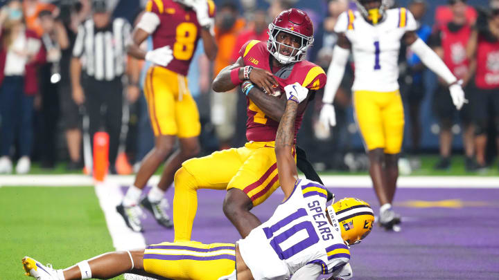 Sep 1, 2024; Paradise, Nevada, USA; Southern California Trojans running back Woody Marks (4) breaks the tackle of LSU Tigers safety Dashawn Spears (10) to score a touchdown in the final seconds of the fourth quarter at Allegiant Stadium.