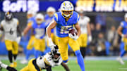 Nov 9, 2025; Inglewood, California, USA; Los Angeles Chargers wide receiver Ladd McConkey (15) carries the ball after a reception against the Pittsburgh Steelers during the fourth quarter of the game at SoFi Stadium. Mandatory Credit: Gary A. Vasquez-Imagn Images