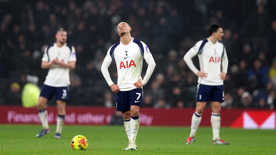 Tottenham players looking distressed.