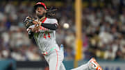 Cincinnati Reds shortstop Elly De La Cruz (44) throws for first to force out right fielder Teoscar Hernandez (37) in the seventh inning of the MLB National League Wild Card Game 2 between the Los Angeles Dodgers and the Cincinnati Reds at Dodger Stadium in Los Angeles on Wednesday, Oct. 1, 2025. The Reds were eliminated from the postseason with an 8-4 loss to the reining World Series Champions La Dodgers.