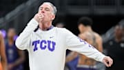 Mar 21, 2024; Indianapolis, IN, USA; Texas Christian University Horned Frogs head coach Jamie Dixon blows his whistle during the NCAA tournament practice day at Gainbridge FieldHouse. Mandatory Credit: Robert Goddin-Imagn Images