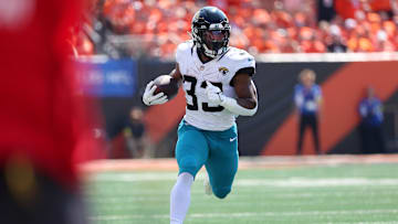 Sep 14, 2025; Cincinnati, Ohio, USA;  Jacksonville Jaguars running back Bhayshul Tuten (33) runs the ball during the first quarter against the Cincinnati Bengals at Paycor Stadium. Mandatory Credit: Joseph Maiorana-Imagn Images