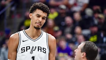 Nov 26, 2024; Salt Lake City, Utah, USA; San Antonio Spurs forward/center Victor Wembanyama (1) talks with referee Scott Twardoski (52) against the Utah Jazz during the first half at the Delta Center. Mandatory Credit: Christopher Creveling-Imagn Images