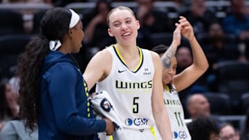 Jul 22, 2025; Seattle, Washington, USA;  Dallas Wings guard Paige Bueckers (5) celebrates with teammates on the bench during the second half against the Seattle Storm at Climate Pledge Arena. Mandatory Credit: Stephen Brashear-Imagn Images