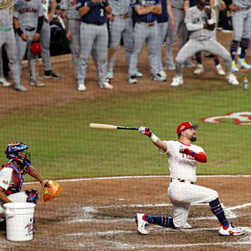 Cumberland, Georgia, USA; National League designated hitter Kyle Schwarber (12) of the Philadelphia Phillies hits a home run in the swing-off of after the 2025 MLB All-Star Game ended in a tie at Truist Park.