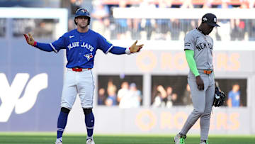 Oct 5, 2025; Toronto, Ontario, CAN; Toronto Blue Jays third baseman Ernie Clement (22) reacts after hitting a double in the third inning against the New York Yankees during game two of the ALDS round for the 2025 MLB playoffs at Rogers Centre. Mandatory Credit: Kevin Sousa-Imagn Images