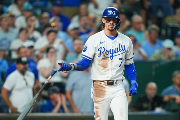 Bobby Witt Jr. reacts after being hit by a pitch.