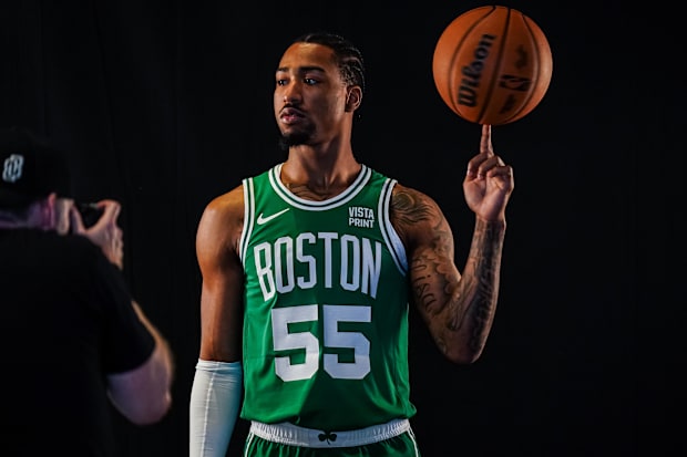 Boston Celtics guard Jay Scrubb (55) spins the ball on his finger during Boston Celtics Media Day.