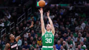 Apr 24, 2024; Boston, Massachusetts, USA; Boston Celtics forward Sam Hauser (30) shoots for three points against Miami Heat guard Delon Wright (4) in the second quarter during game two of the first round for the 2024 NBA playoffs at TD Garden. Mandatory Credit: David Butler II-USA TODAY Sports