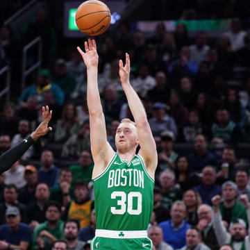 Apr 24, 2024; Boston, Massachusetts, USA; Boston Celtics forward Sam Hauser (30) shoots for three points against Miami Heat guard Delon Wright (4) in the second quarter during game two of the first round for the 2024 NBA playoffs at TD Garden. Mandatory Credit: David Butler II-USA TODAY Sports