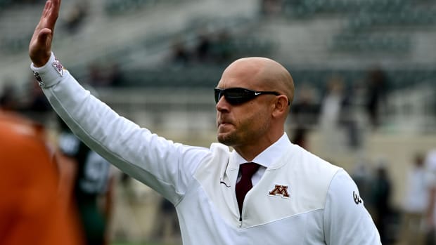 Minnesota Golden Gophers head coach PJ Fleck waves to fans at Spartan Stadium before playing MSU.