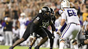 Texas A&M Aggies defensive lineman Nic Scourton (11) rushes against LSU Tigers offensive tackle Will Campbell (66)