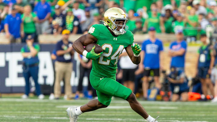 Oct 4, 2025; South Bend, Indiana, USA; Notre Dame Fighting Irish running back Jadarian Price (24) runs the ball against the Boise State Broncos at Notre Dame Stadium. Mandatory Credit: Michael Caterina-Imagn Images Oct 4, 2025; South Bend, Indiana, USA; Notre Dame Fighting Irish running back Jadarian Price (24) runs the ball against the Boise State Broncos at Notre Dame Stadium. Mandatory Credit: Michael Caterina-Imagn Images