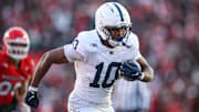 Nov 29, 2025; Piscataway, New Jersey, USA; Penn State Nittany Lions running back Nicholas Singleton (10) carries the ball against the Rutgers Scarlet Knights during the first half at SHI Stadium. Mandatory Credit: Vincent Carchietta-Imagn Images