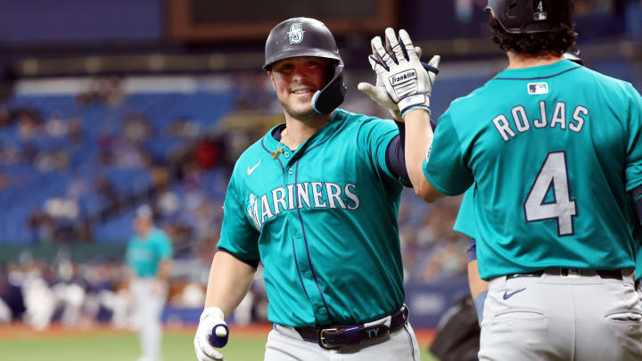 Seattle Mariners first baseman Ty France is congratulated by third base Josh Rojas after he hit a two-run home run against the Tampa Bay Rays.