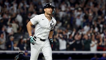 Oct 30, 2024; New York, New York, USA; New York Yankees designated hitter Giancarlo Stanton (27) reacts after hitting a home run during the third inning against the Los Angeles Dodgers in game five of the 2024 MLB World Series at Yankee Stadium. Mandatory Credit: Vincent Carchietta-Imagn Images