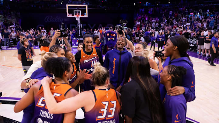 Jul 9, 2025; Phoenix, Arizona, USA; Phoenix Mercury players huddle together and celebrate the victory over the Minnesota Lynx at PHX Arena. Mandatory Credit: Mark J. Rebilas-Imagn Images