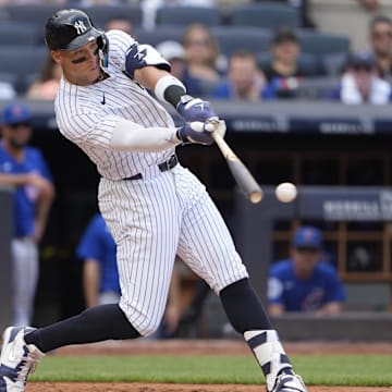 Jul 12, 2025; Bronx, New York, USA; New York Yankees right fielder Aaron Judge (99) hits a double during the fourth inning at Yankee Stadium. Mandatory Credit: Gregory Fisher-Imagn Images