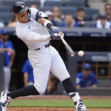 New York Yankees right fielder Aaron Judge (99) hits a double during the fourth inning at Yankee Stadium. 