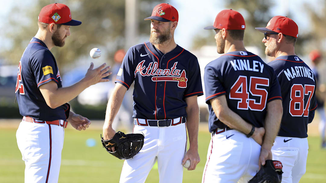 Feb 10, 2026; North Port, FL, USA; Atlanta Braves pitcher Chris Sale (51) talks with pitcher Dylan Lee (52), pitcher Tyler Kinley (45) and coach J.P. Martinez (87) works out during spring training workouts. Mandatory Credit: Kim Klement Neitzel-Imagn Images