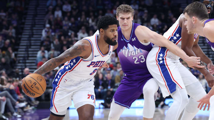 Dec 28, 2024; Salt Lake City, Utah, USA; Philadelphia 76ers forward Paul George (8) dribbles against Utah Jazz forward Lauri Markkanen (23) during the first quarter at Delta Center. Mandatory Credit: Rob Gray-Imagn Images Dec 28, 2024; Salt Lake City, Utah, USA; Philadelphia 76ers forward Paul George (8) dribbles against Utah Jazz forward Lauri Markkanen (23) during the first quarter at Delta Center. Mandatory Credit: Rob Gray-Imagn Images