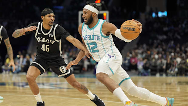 Charlotte Hornets forward Josh Okogie (12) drives to the basket against Brooklyn Nets guard Keon Johnson (45) 