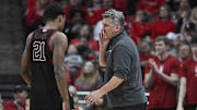 Mar 8, 2025; Louisville, Kentucky, USA;  Stanford Cardinal head coach Kyle Smith talks with guard Jaylen Blakes (21) during the second half against the Louisville Cardinals at KFC Yum! Center. Louisville defeated Stanford 68-48. Mandatory Credit: Jamie Rhodes-Imagn Images