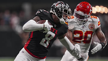 Sep 22, 2024; Atlanta, Georgia, USA; Atlanta Falcons tight end Kyle Pitts (8) runs against Kansas City Chiefs safety Justin Reid (20) after a catch during the first half at Mercedes-Benz Stadium. Mandatory Credit: Dale Zanine-Imagn Images