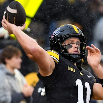 Iowa Hawkeyes quarterback Mark Gronowski (11) warms up Nov. 8, 2025 before a Big Ten Football game against the Oregon Ducks at Kinnick Stadium in Iowa City, Iowa.