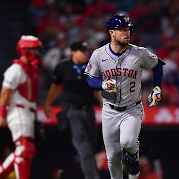 Sep 13, 2024; Anaheim, California, USA; Houston Astros third baseman Alex Bregman (2) hits a single against the Los Angeles Angels during the seventh inning at Angel Stadium.