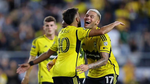 Columbus Crew SC players hug.