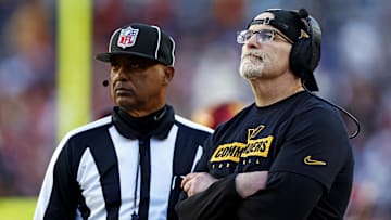 Nov 24, 2024; Landover, Maryland, USA; Washington Commanders head coach Dan Quinn watches a replay on the video board during the third quarter of the game against the Dallas Cowboys at Northwest Stadium. Mandatory Credit: Peter Casey-Imagn Images