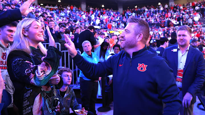 Dec 3, 2025; Auburn, Alabama, USA;  Auburn Tigers football head coach Alex Golesh greets fans before a game against the NC State Wolfpack at Neville Arena. Mandatory Credit: John Reed-Imagn Images