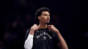 Feb 15, 2025; Oakland, CA, USA; Chuck’s Global Stars forward Victor Wembanyama (1) of the San Antonio Spurs stands on the court during the NBA All Star-Practice at Oracle Arena. Mandatory Credit: Cary Edmondson-Imagn Images