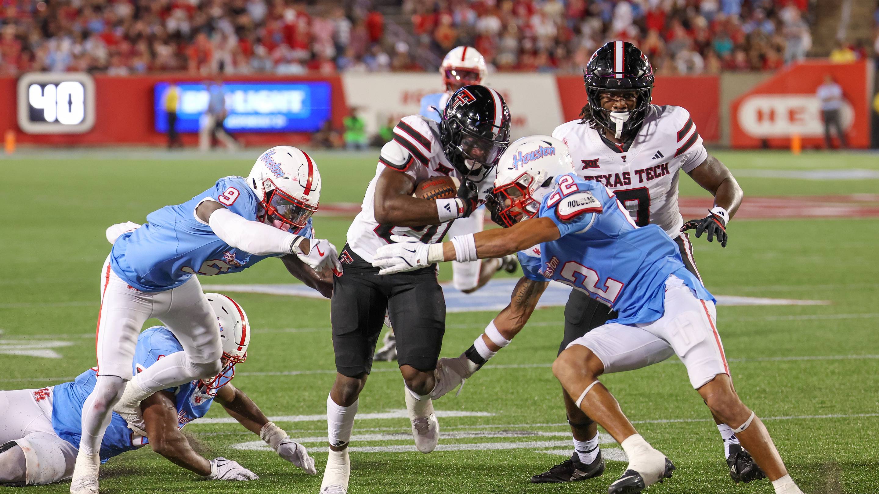 Texas Tech RB J'Koby Williams rushes against Houston DB Marc Stampley II in the second half at TDECU Stadium. Mandatory Credit: Thomas Shea-Imagn Images | IMAGN IMAGES via Reuters Connect